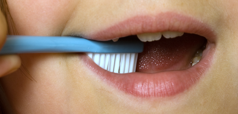 A child brushing their teeth